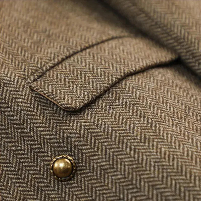 Women's slim fit blazer in beige herringbone tweed fabric - closeup detail of gold button and notch collar stitching