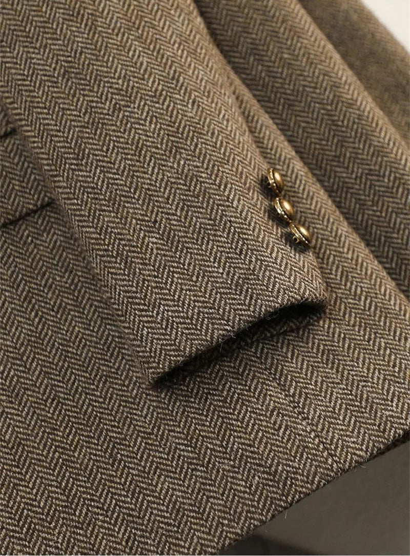 Women's slim fit blazer in brown herringbone tweed - closeup detail of front pocket and gold button
