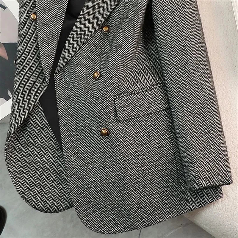 Women's slim fit blazer in gray herringbone tweed - closeup detail of double-breasted gold buttons and front pocket
