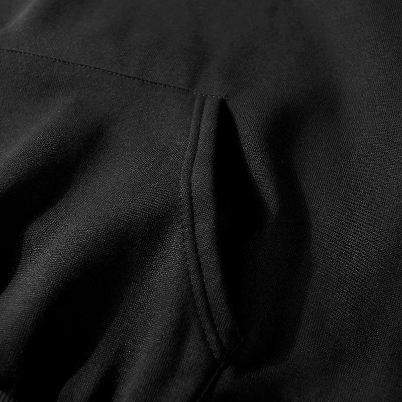 Close-up of black hoodie tracksuit premium fleece fabric with stitching detail