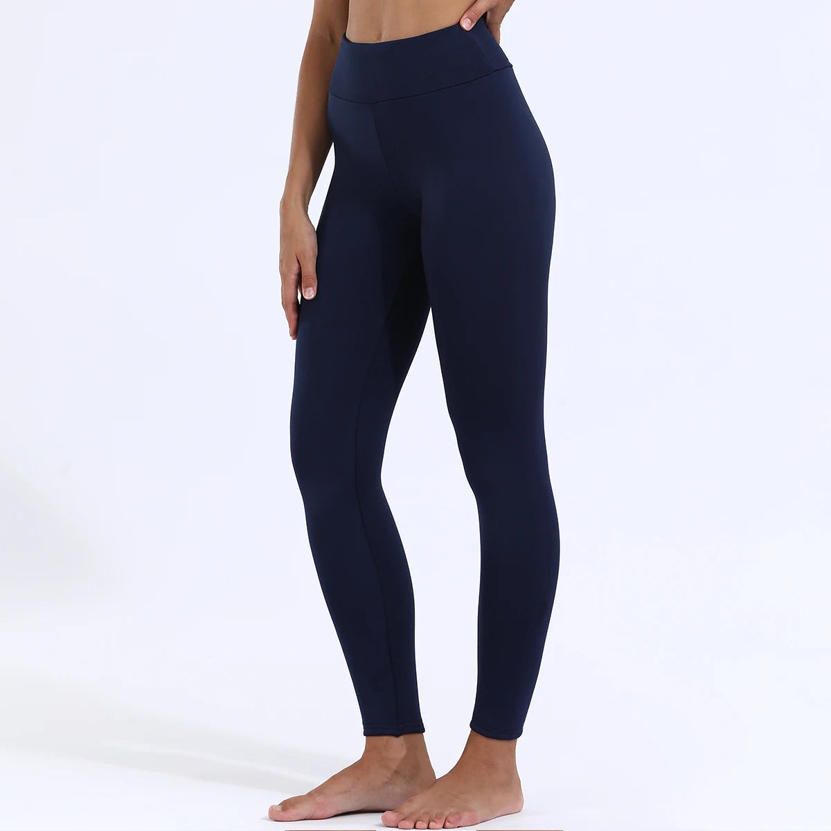 Women's high waist velvet winter leggings in navy blue, full length front view styled on model showing slim fit and high waist design, barefoot