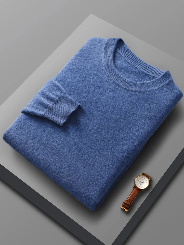 Men's merino wool crew neck sweater in light blue, folded flat lay