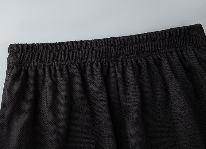 Men's sports shorts - waistband and fabric close-up detail
