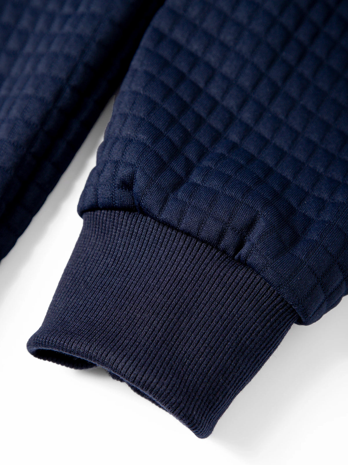 Men's waffle knit pullover hoodie, close-up of ribbed hem