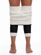 Legging femme doublé polaire, noir, porté à l'envers pour montrer l'épaisse doublure en polaire