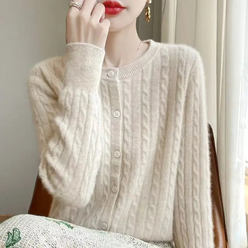 Women's cream cable knit crew neck sweater on model