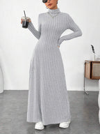 Women's light gray ribbed turtleneck maxi dress, styled front view
